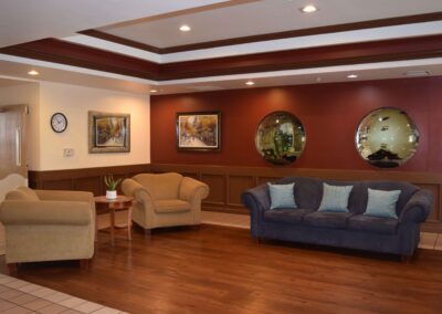 Living room with Sofa, paintings and round mirror